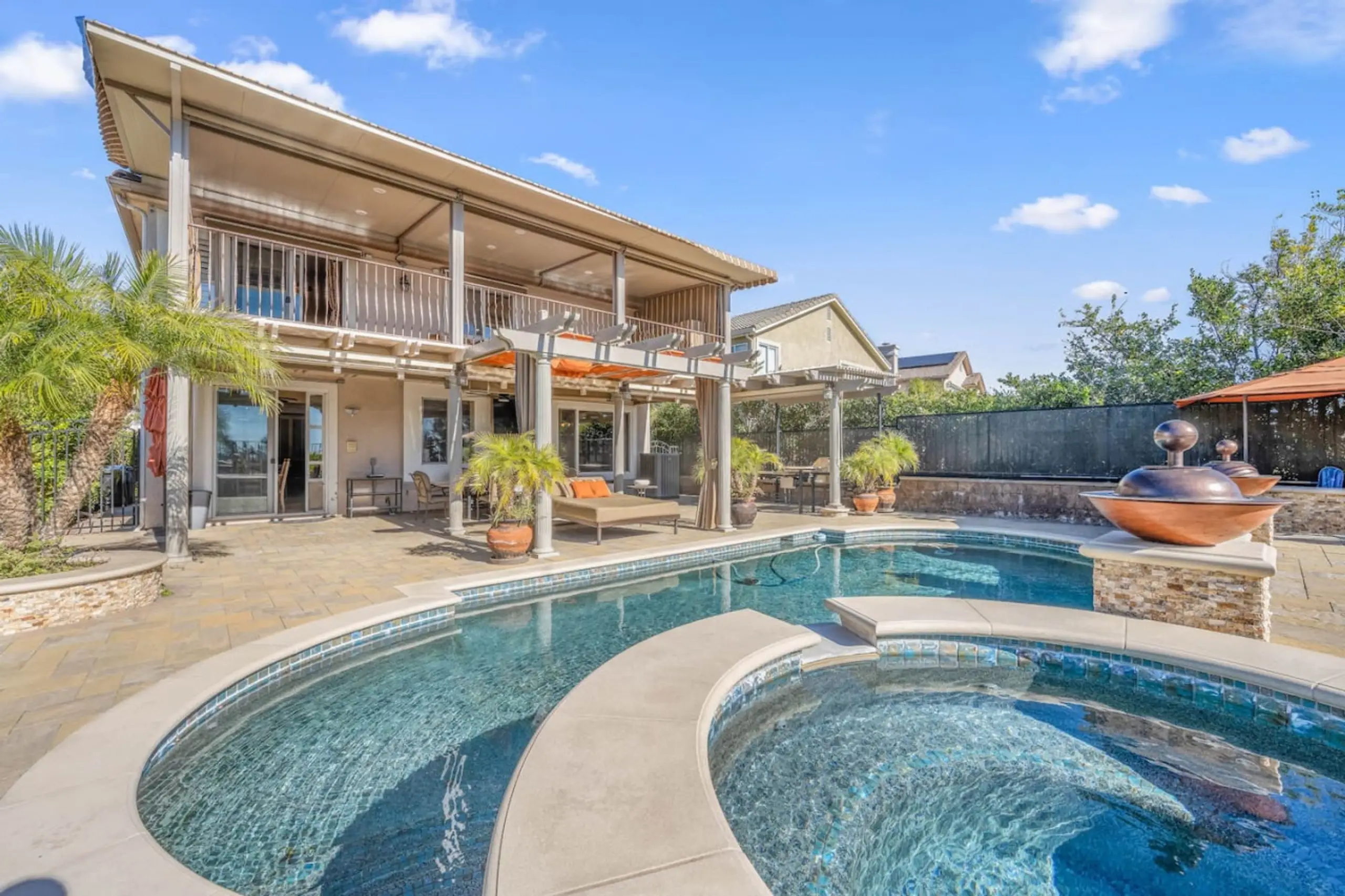 A poolside terrace at one of our Southern California homes